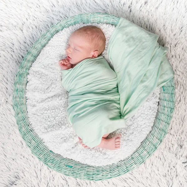 Sweet newborn wrapped in a nappy sleeping — Stock Photo, Image