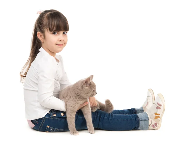 Cute little girl with cat in hands — Stock Photo, Image