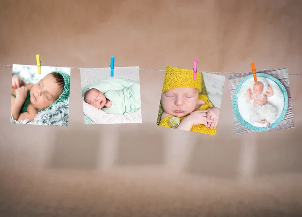 Paper cards of babies hanging on the rope — Stock Photo, Image