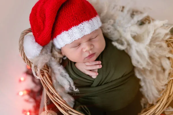 Lovely newborn wearing santa hat — Stock Photo, Image