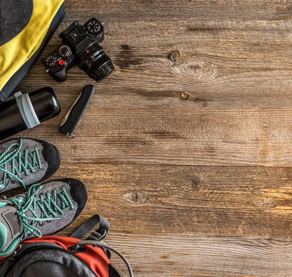 Trekking equipment on wooden background — Stock Photo, Image