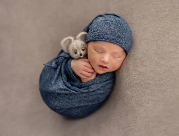 Charming newborn smiling in dream — Stock Photo, Image