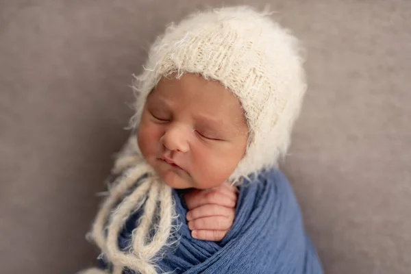 Charming newborn in knitted hat — Stock Photo, Image