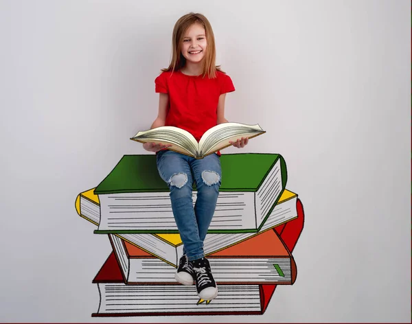 Little girl reading sitting on books stack — Stock Photo, Image