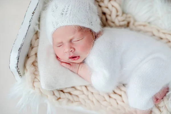 Newborn sleeping on tiny bed — Stock Photo, Image