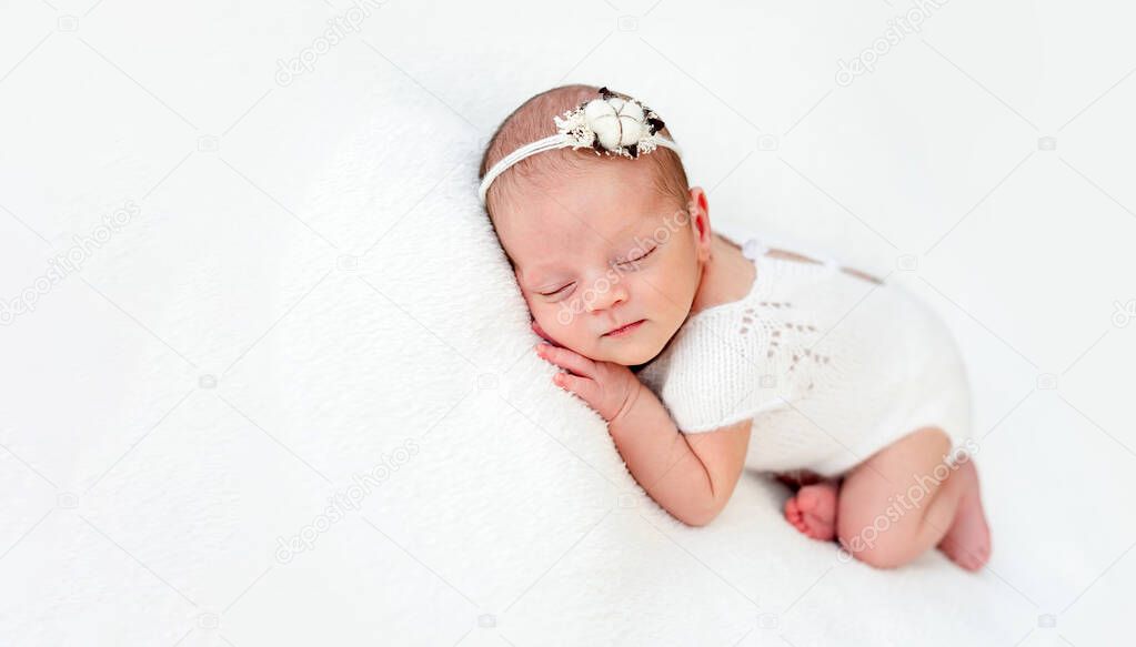 Sleeping newborn baby girl