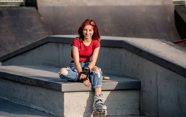 Girl with roller skates outdoors — Stock Photo, Image