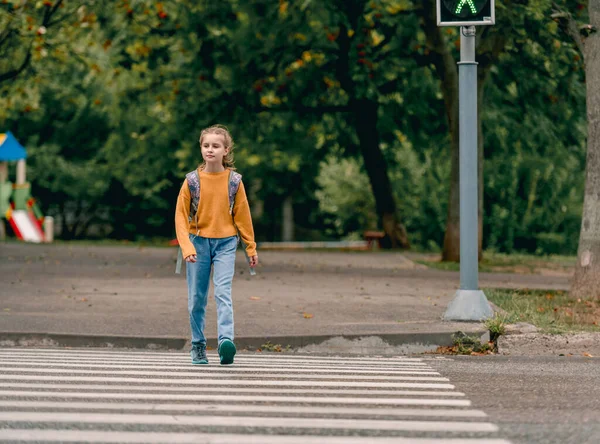 Schoolgirl with backpack outdoors — Stock Photo, Image