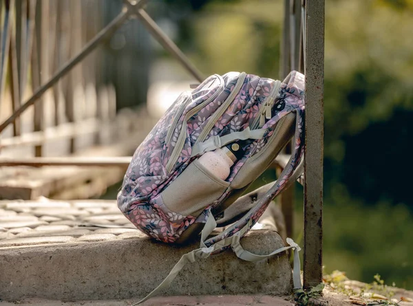 School backpack at the street — Stock Photo, Image