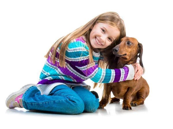 Happy little girl with her dachshund — Stock Photo, Image