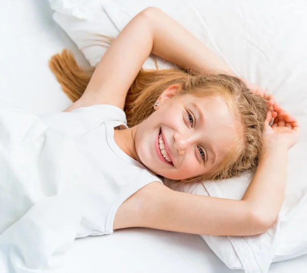 Smiling little girl woke up — Stock Photo, Image