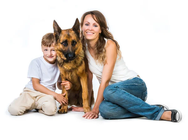 Mother with two children and their shepherd — Stock Photo, Image