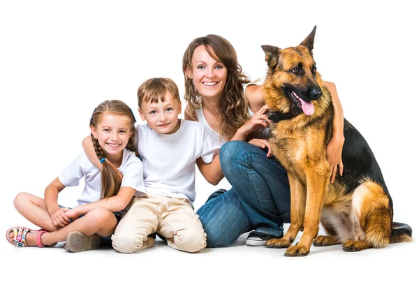 Mother with two children and their shepherd — Stock Photo, Image