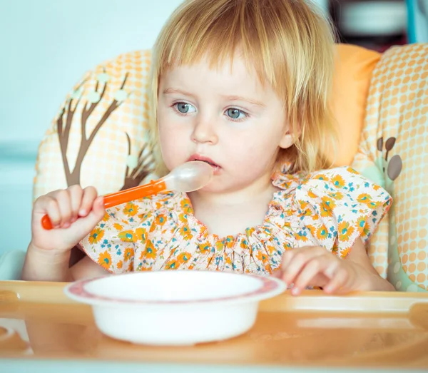 Baby girl is going to eat Stock Photo