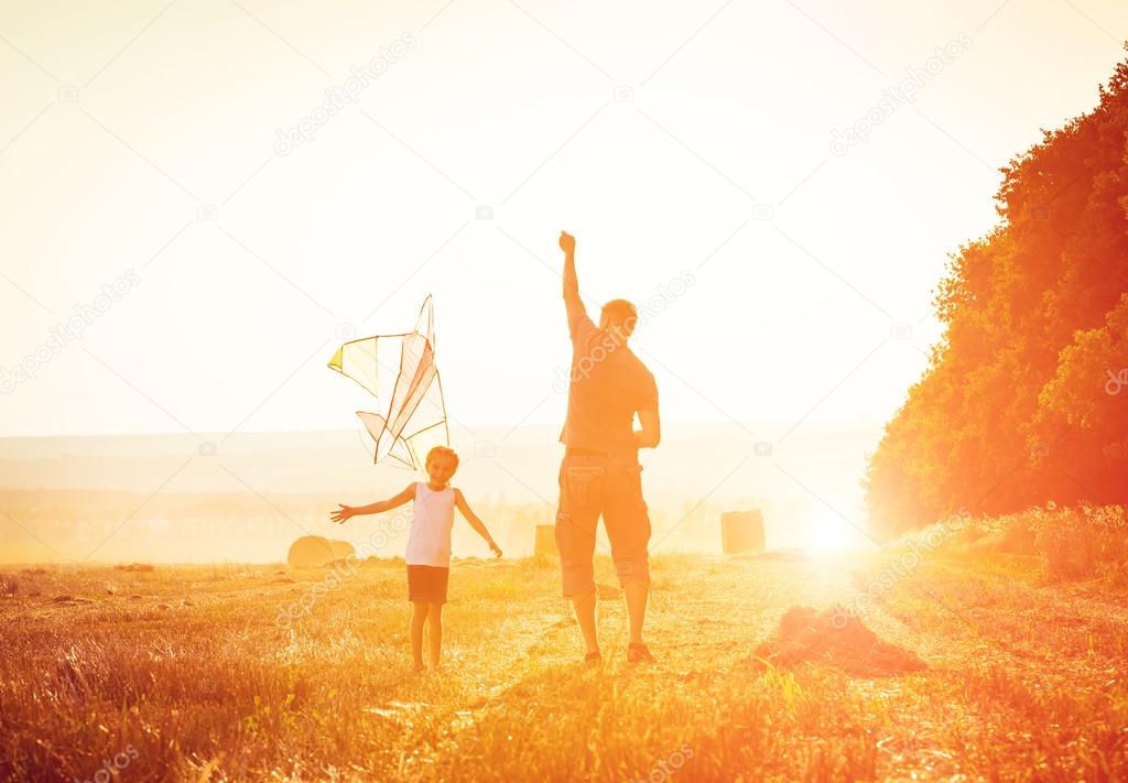 Dad with his daughter let a kite