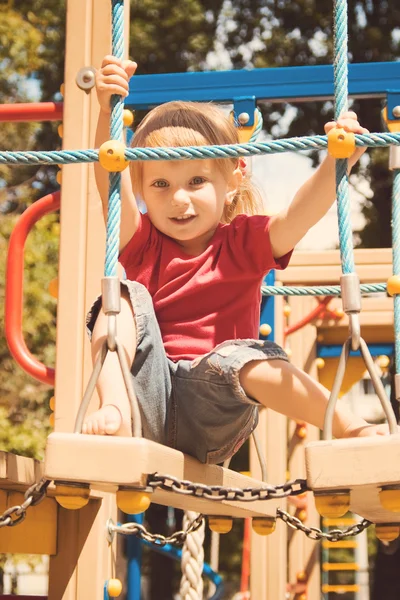 Cute little girl on a playground — Stock Photo, Image