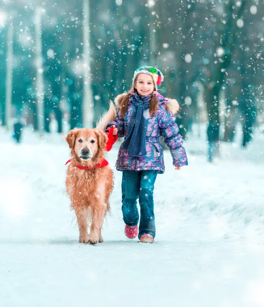 Little girl with her dog Royalty Free Stock Photos