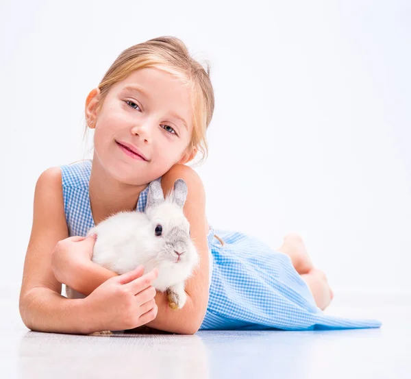 Little girl a white rabbit — Stock Photo, Image
