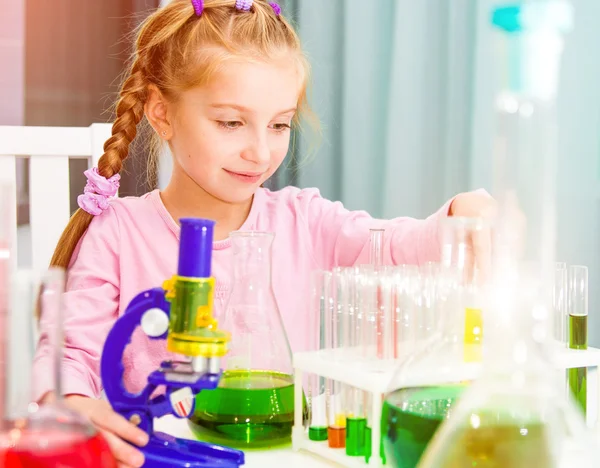 Little girl with flasks — Stock Photo, Image