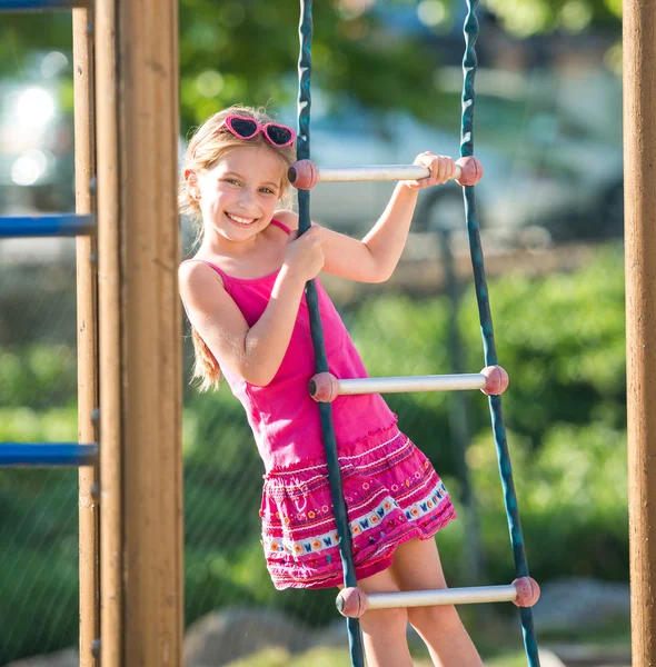 Menina no parque infantil — Fotografia de Stock