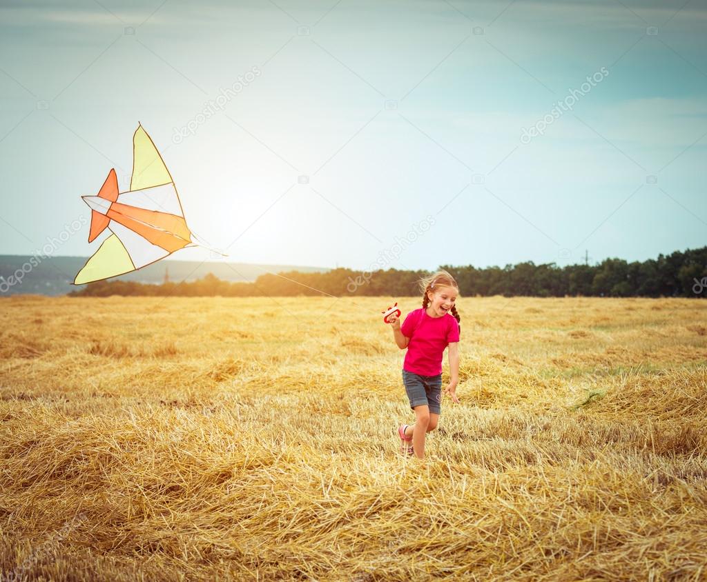 Beautiful little girl with kite