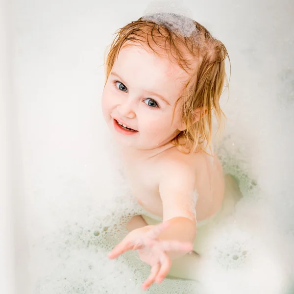 Baby bathes in  bath — Stock Photo, Image