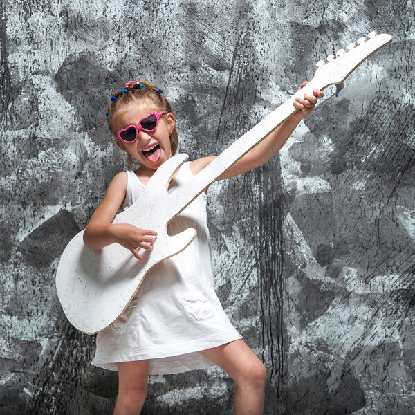 Little girl with her guitar