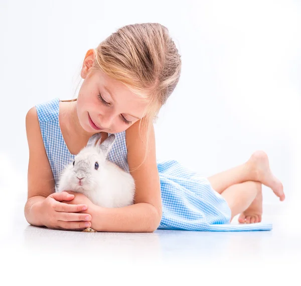 Little girl with white rabbit — Stock Photo, Image