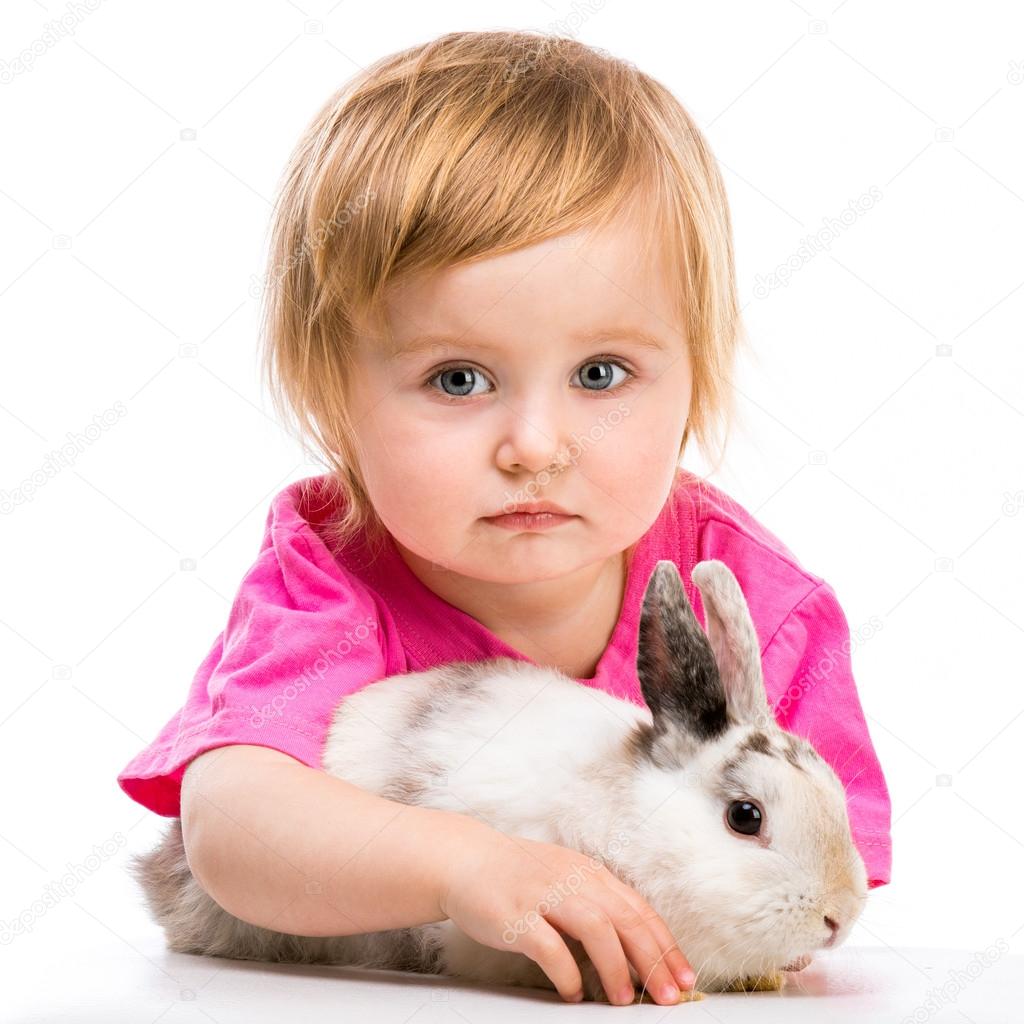 Baby girl  with her rabbit
