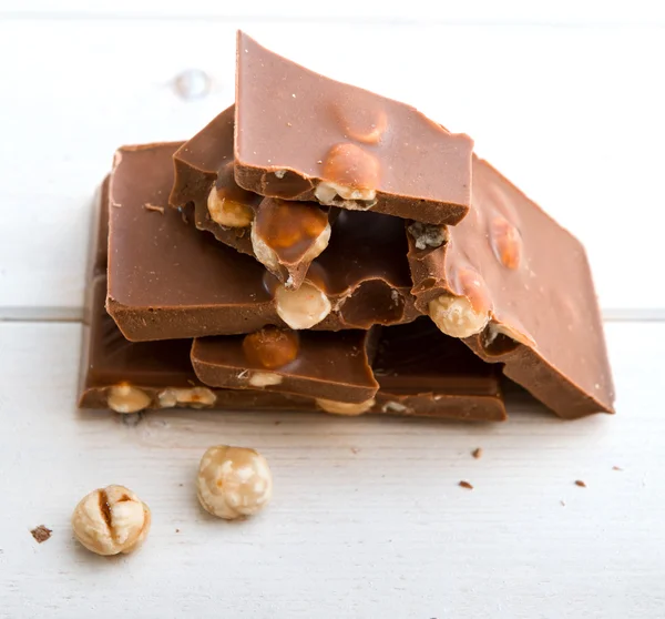 Milk chocolate with nuts — Stock Photo, Image