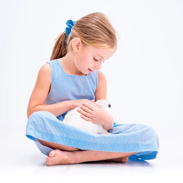 Little girl with white rabbit — Stock Photo, Image