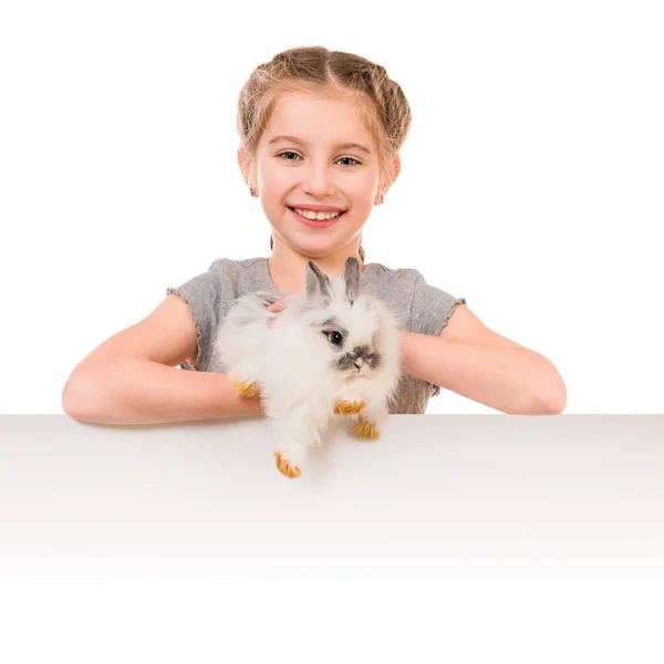 Little girl with a rabbit — Stockfoto