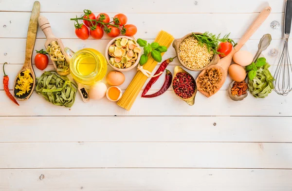 Uncooked pasta and spices — Stock Photo, Image