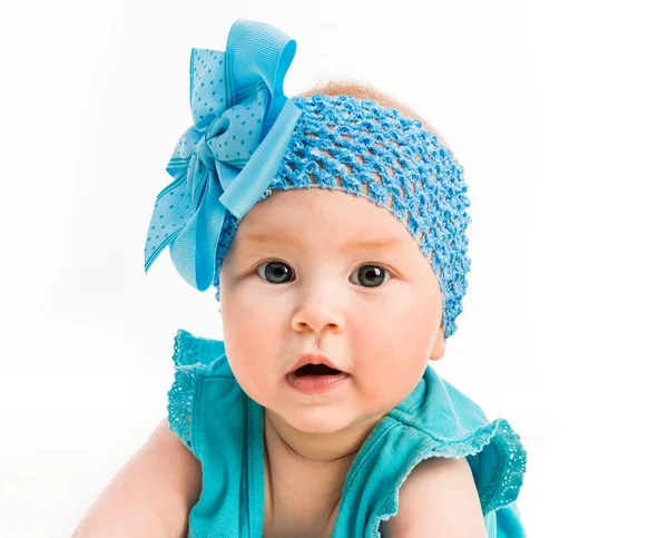 Baby girl in blue dress Stock Picture