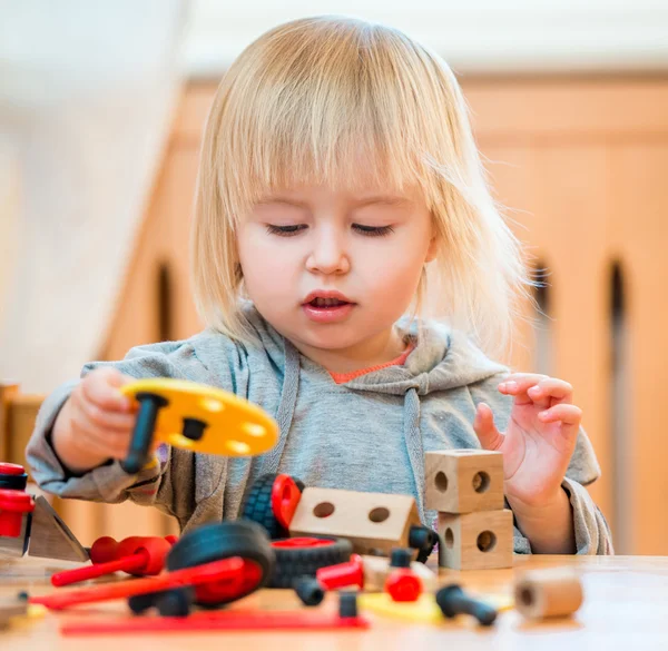 Cute girl playing with constructor — Stock Photo, Image