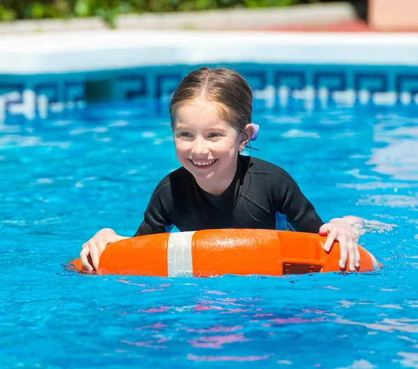 Happy little girl in  wetsuit — Stock Photo, Image