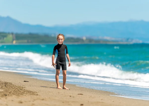 Happy little girl in  wetsuit — Stock Photo, Image