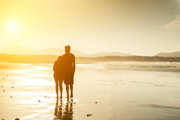 Silhouettes of  couple at beach