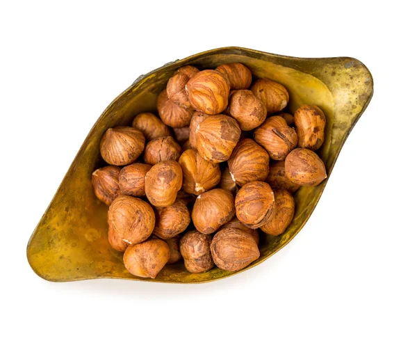 Lískové ořechy v kovu pohár — Stock fotografie