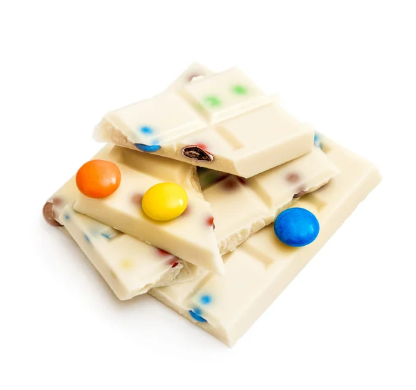 White chocolate with colored pills — Stock Photo, Image