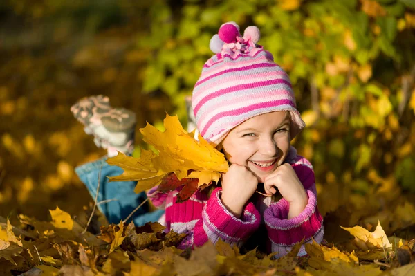 Little girl lie on  leaves — Stock Photo, Image