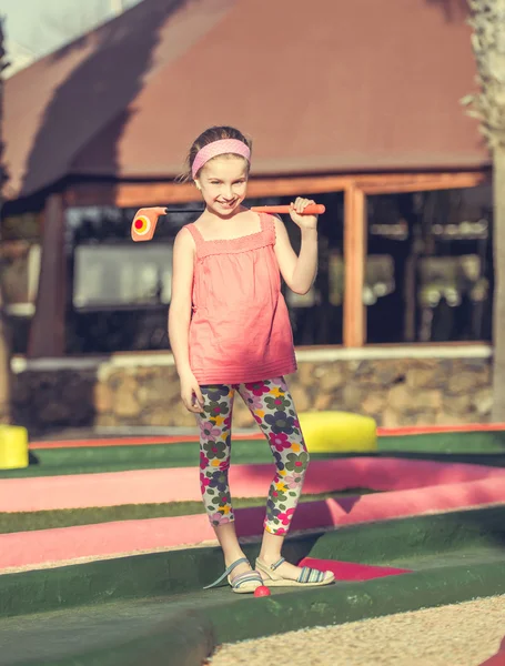 Little girl playing golf — Stock Photo, Image