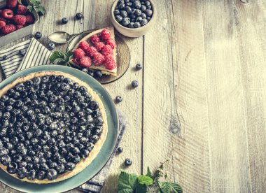 Tart with blueberries on  wooden background