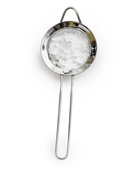 Powdered sugar in a metal sieve — Stock Photo, Image