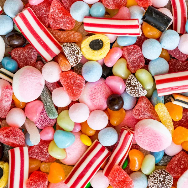 Різноманітність цукерок як фон — стокове фото