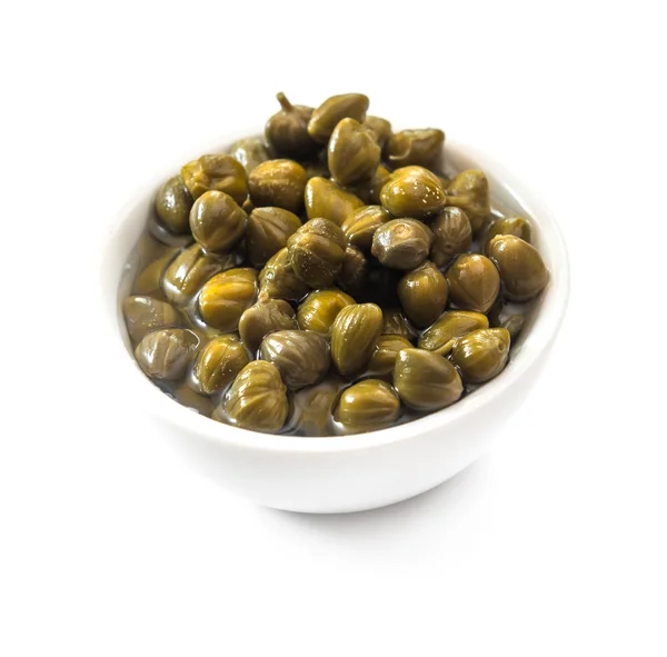 Bowl of capers  isolated — Zdjęcie stockowe