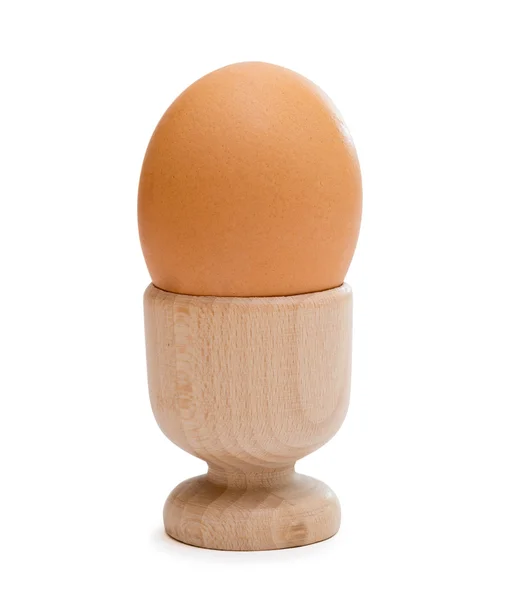 Brown egg in wooden cup — Stock Photo, Image