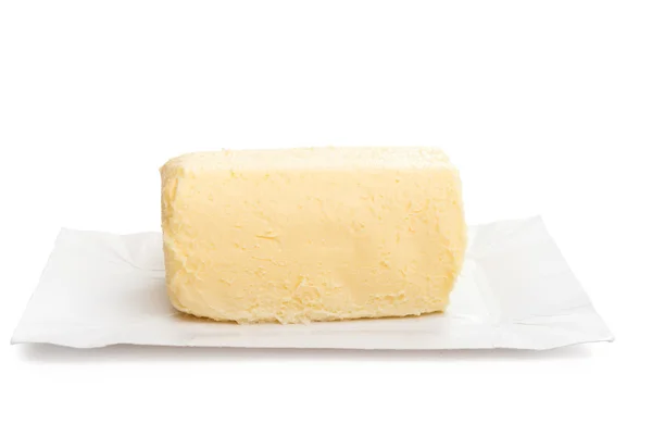 Pièce de beurre sur fond — Photo