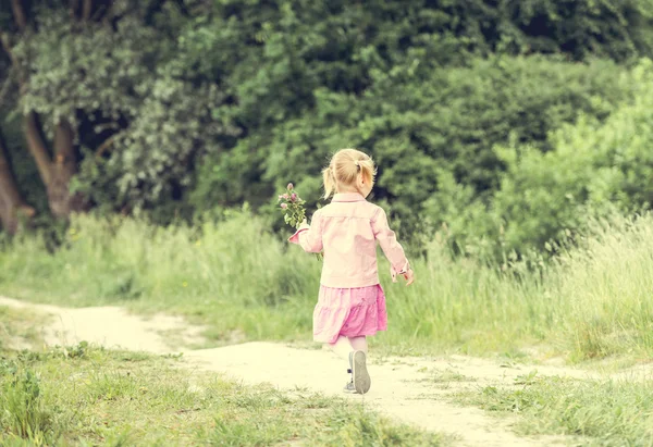 Cute little girl on  meadow — Stock Photo, Image