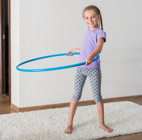 Smiling girl  with hula hoop a — Stock Photo, Image